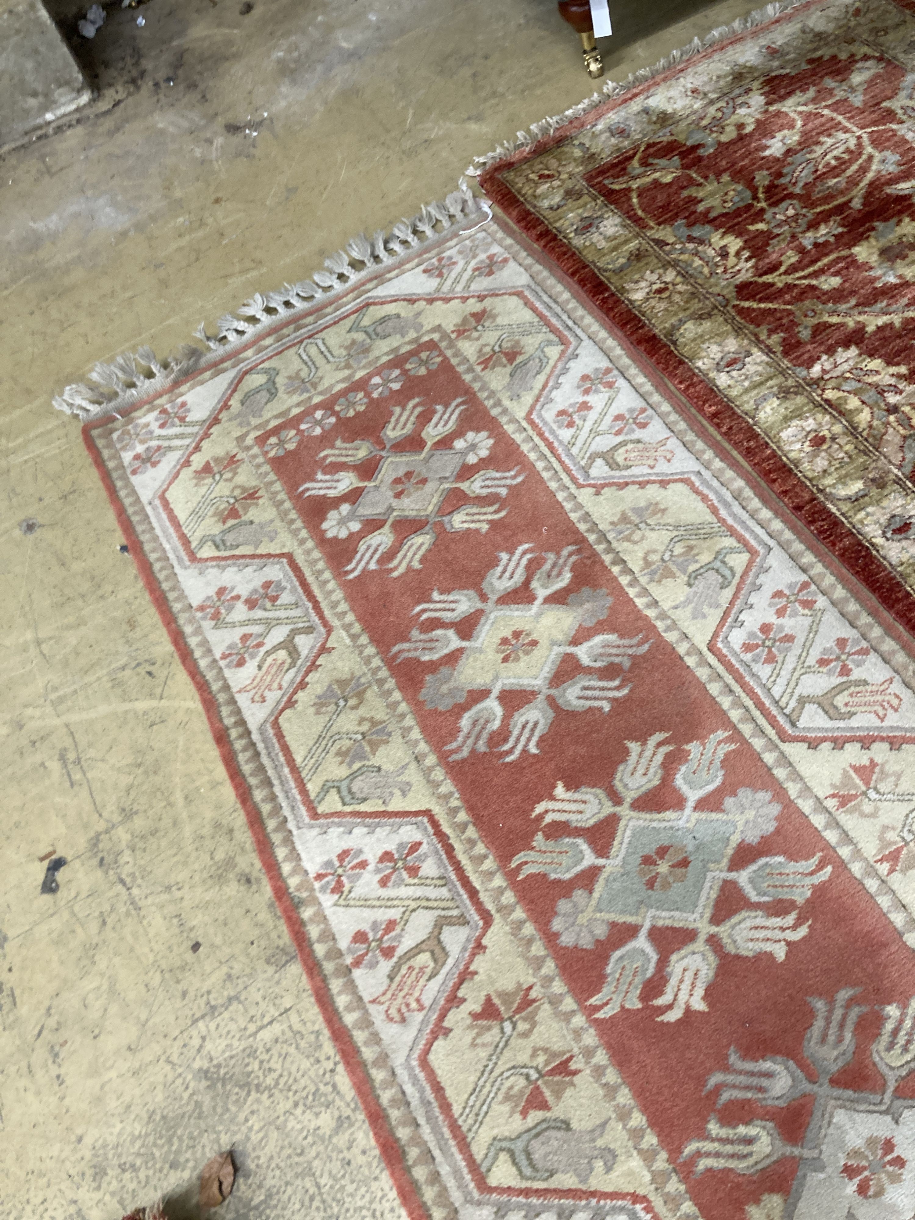 An Afghan Ziegler peach ground runner and another runner, largest 310 x 84cm